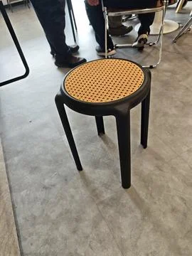 Cane Top Stool with Black Frame Stock Photos