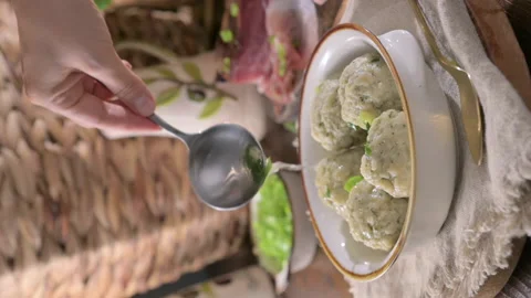 Canederli or Knodel in broth with green onion. North italian traditional dish, Stock Footage 231509448
