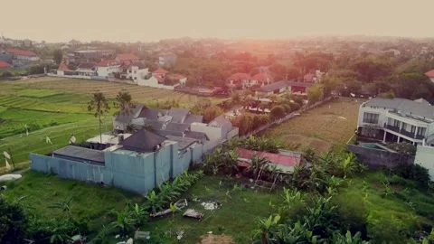 Canggu backyards and rice fields at sunset Video stock 130909027