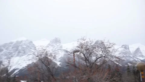 Canmore Snowy Mountain Range Fast Pan Across Stock Footage 144386867