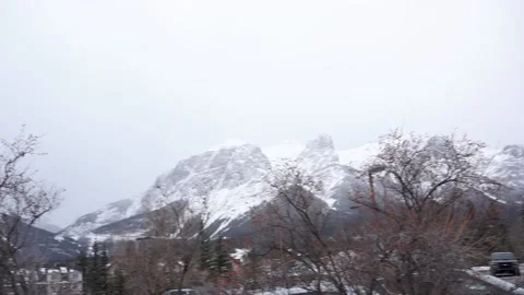 Canmore Snowy Mountain Range Slow Pan Across Stock Footage 144386868