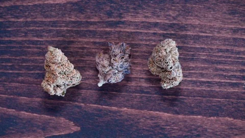 Cannabis buds on wood table Stock Footage 101040029
