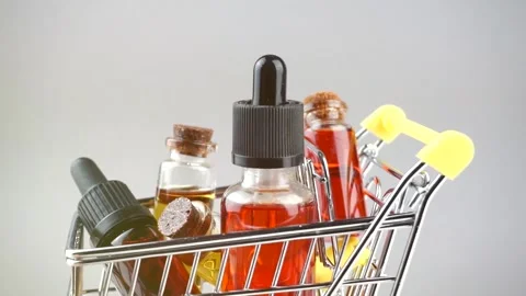 Cannabis CBD and THC oils in Shopping cart, Purchase and Delivery concept Stock Footage 149716061
