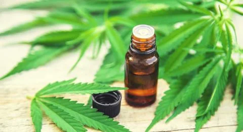 Cannabis extract in a small bottle. Selective focus. Stock Photos
