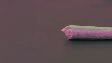 Cannabis Pre-rolled joint close up pan- Stock Footage 90031722