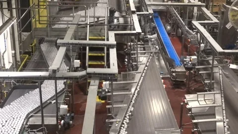 Canned beverages stream off assembly line canning plant Stock Footage 76807616