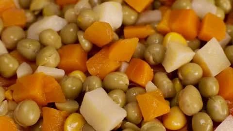 Canned boiled vegetables - peas, corn, carrots rotate, close-up Stock Footage 230180824