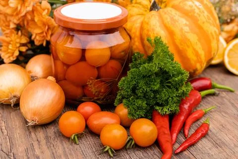Canned cherry tomatoes. Vegetables for preservation on the table in the kitchen Stock Photos