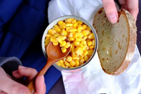 Canned corn and bread Stock Photos