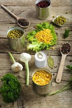 Canned corn, peas, beans Stock Photos