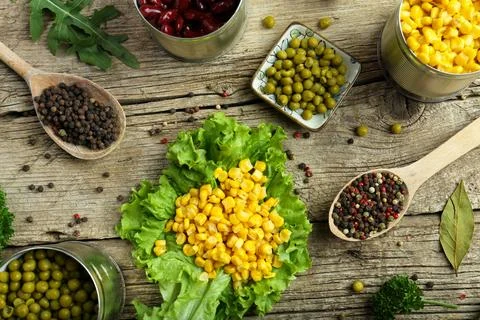 Canned corn, peas, beans Stock Photos