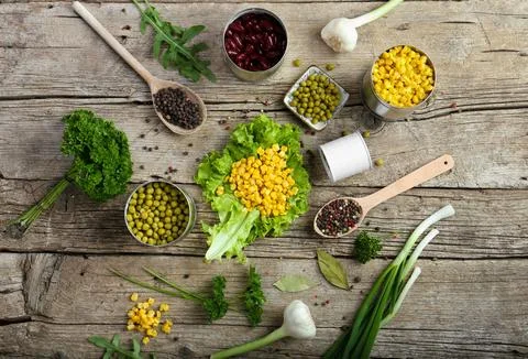 Canned corn, peas, beans Stock Photos