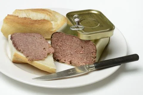 Canned corned beef, beef on plate with knife Stock Photos