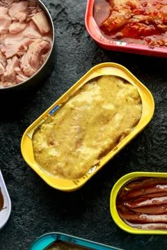 Canned fish with different assortment types of seafood on rustic stone Foto stock