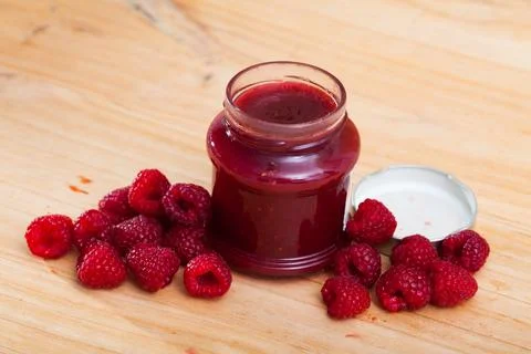 Canned raspberry jam Stock Photos