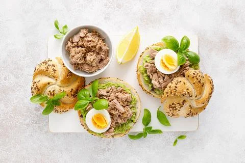 Canned tuna open sandwiches. Buns burgers with canned tuna, boiled egg Stock Photos