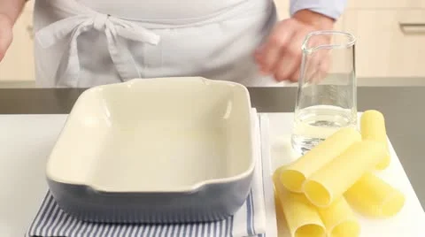 Cannelloni being filled with a spinach and ricotta mixture Stock Footage 24658456