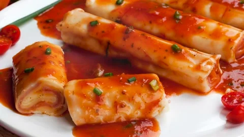Cannelloni stuffed with ham and cheese in tomato sauce Stock Footage 142225764