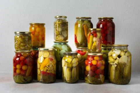 Canning is a common activity in the kitchen as jars filled with vegetables .. Stock-Fotos