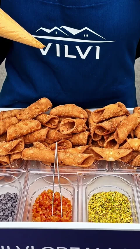 Cannoli Shells and Toppings Prepared by Vendor at Street Food Stall, Close Up Stock Footage 337745761