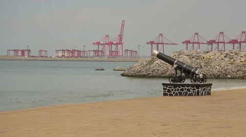 Cannon and cargo cranes on the Sri Lanka beach Stock Footage 49365064