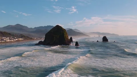 Cannon Beach Drone Footage Featuring Haystack Rock and Rocky Shoreline Stock Footage 332071430