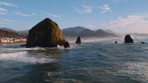 Cannon Beach Drone View with Ocean, Mountains, and Haystack Rock Stock Footage 332084309