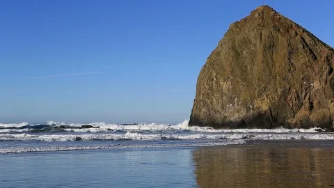 Cannon Beach with Haystack Rock and Needles along Oregon Coast 1080p Stock Footage 83193018
