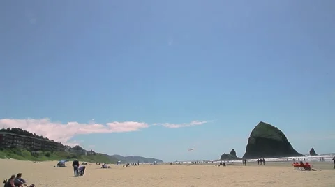 Cannon Beach, Oregon with haystack rock and people on beach Stock Footage 57226615