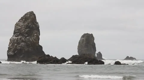 Cannon Beach Oregon Oceanfront at Lowtide One Early Foggy Morning Stock Footage 25512669