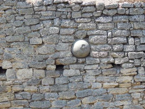 Cannon core stuck in the wall. Stock Photos