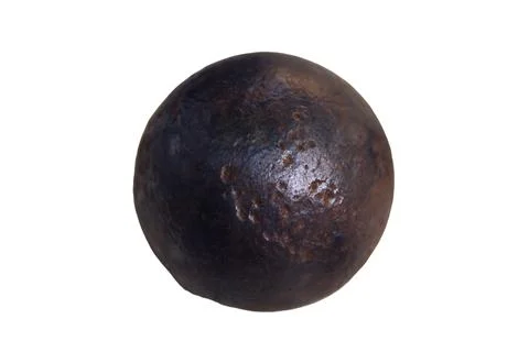 Cannonball six-pound close-up, isolated on white background. Old objects of.. Stock Photos