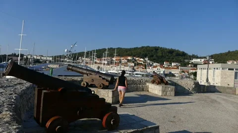 Cannons on Old Tower With View - People Passing by Stock Footage 54913997