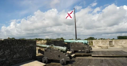 Cannons on top of Castillo de San Marcos fort with Cross of Burgundy flag flying Stock Footage 210301700