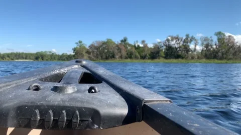 Canoe Bow Closeup Focus Trees Lake Background Blurry Stock Footage 218989575