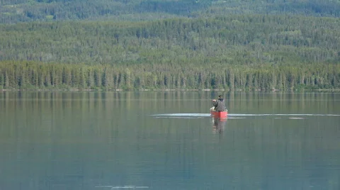 Canoe fishing mountain lake P HD 0167 Stock Footage