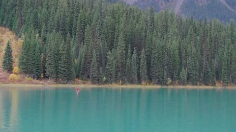 Canoe floating on the turquoise waters of Lake Louise in Banff National Park Stock Footage 197042960