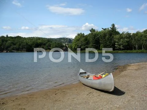 Canoe on lake in northern ontario Stock Photos