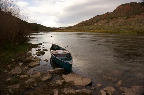 Canoe on large river Stock Photos