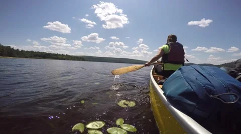 Canoe paddling on lake unique angle Video stock 55385272