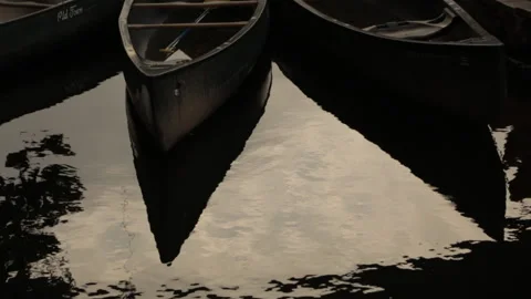 Canoe reflection on river Stock Footage 145737620