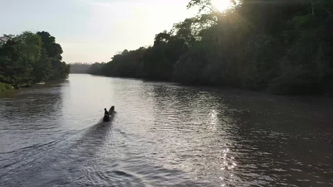 Canoe sailing on a river surrounded by trees 1 Stock Footage 111611660