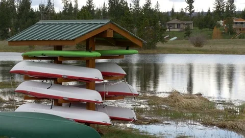 Canoe on stand by the lake. Video stock 77579169