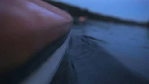 Canoe with surface split view. Low angle view of a canoe in the water Stock Footage 81067931