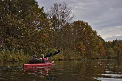 A canoe with two passengers Stock Photos