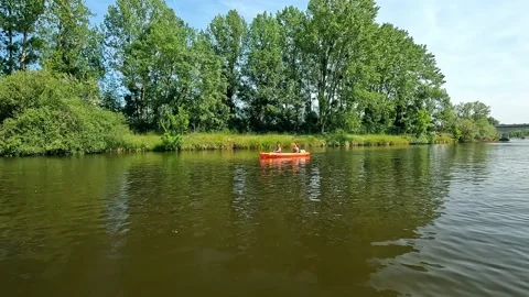 Canoeing along the river Stock Footage 264027068