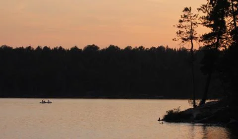 Canoeing at Dusk Stock Photos
