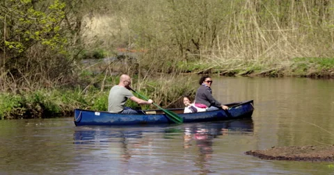 Canoeing group paddling and singing 3 4K Stock Footage 49275091