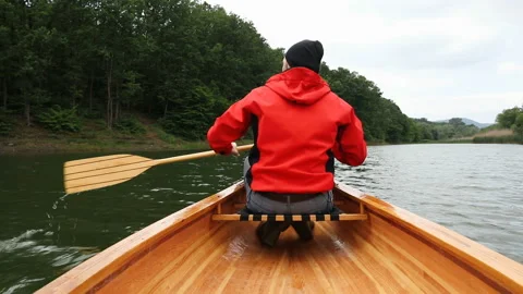 Canoeing on lake Stock Footage 131298642