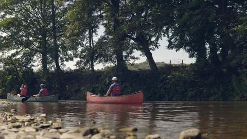 A canoeing lesson taking place on a river Stock Footage 98267520